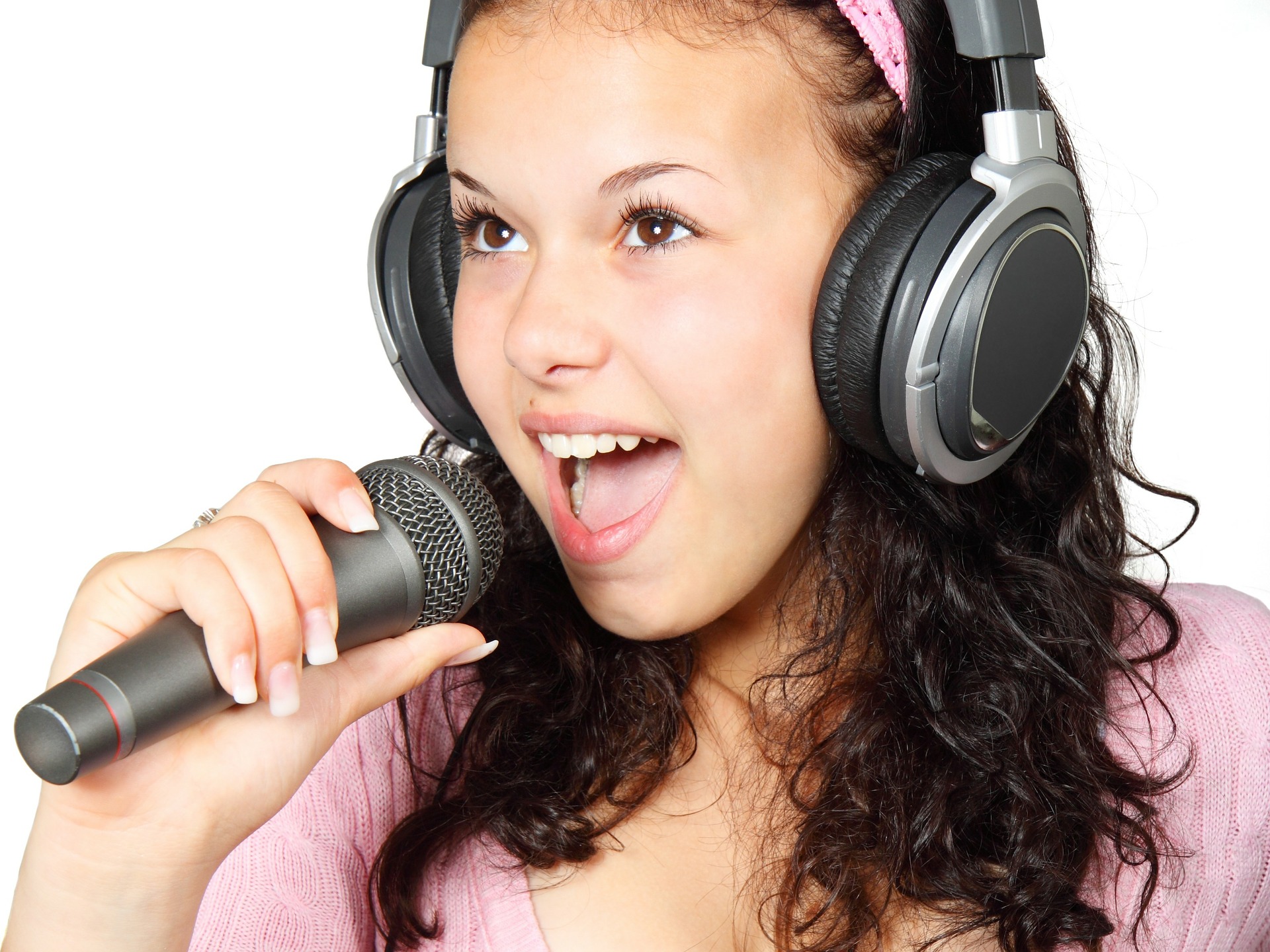 Image of Adolescent Girl Singing On The Microphone